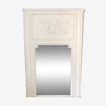 Fireplace trumeau mirror decorated with the attributes of music