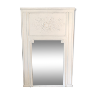Fireplace trumeau mirror decorated with the attributes of music