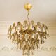 Vintage chandelier in gilded brass with crystal pendants.