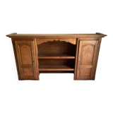 Upper part of a rustic solid oak dresser with its cornice.