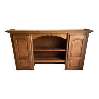 Upper part of a rustic solid oak dresser with its cornice.