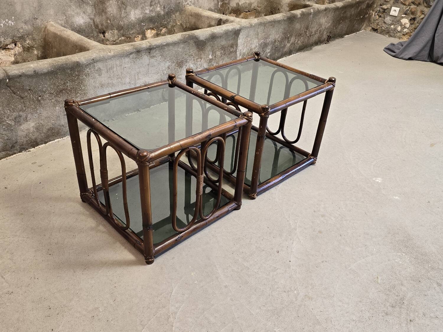 Two rattan and smoked glass tables, 1970