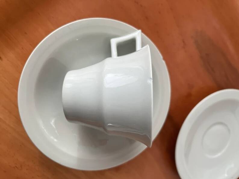 Art Deco cups and saucers by Théodore Haviland in celadon.