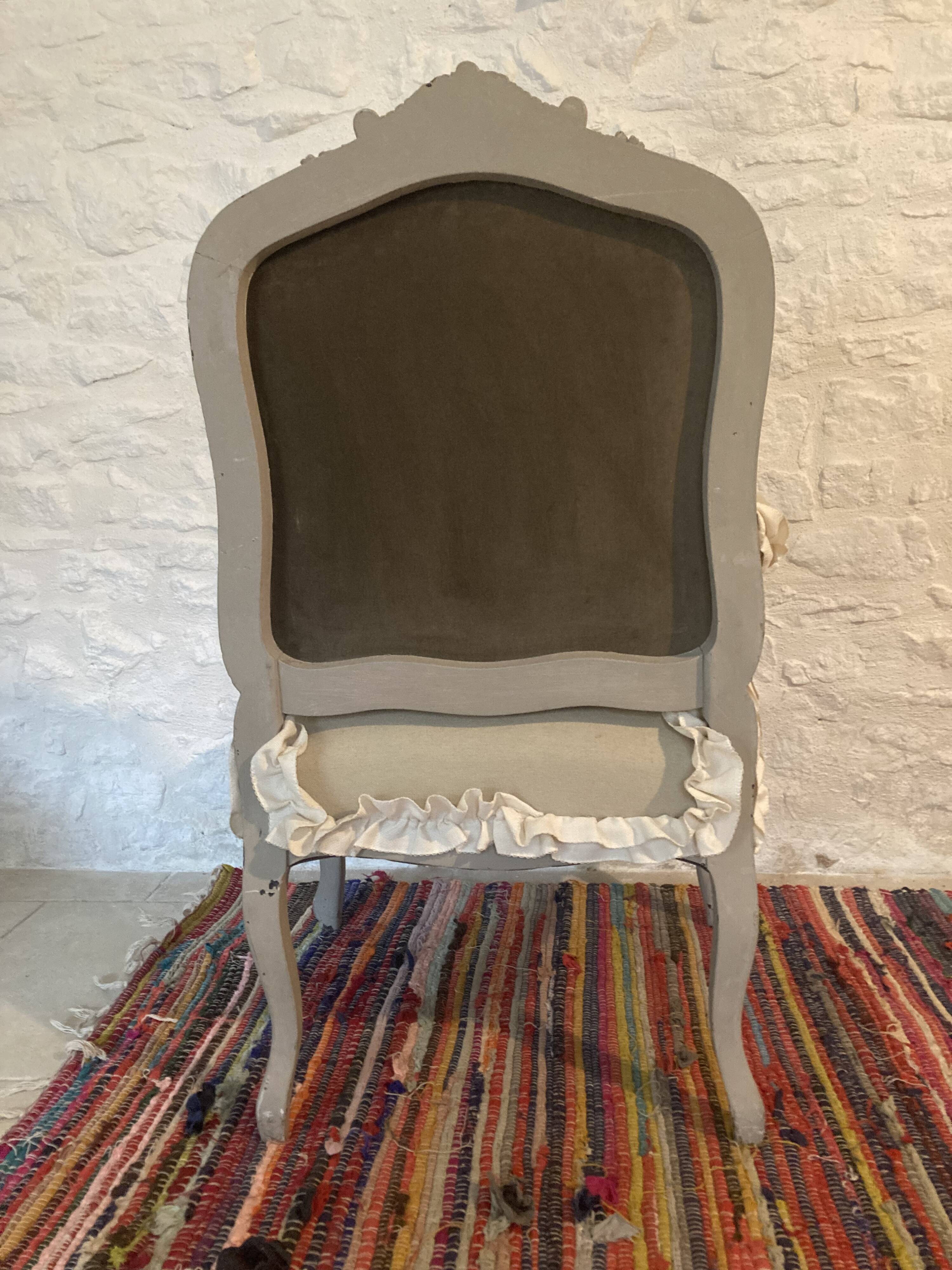 Frilly Regency style bergère armchair