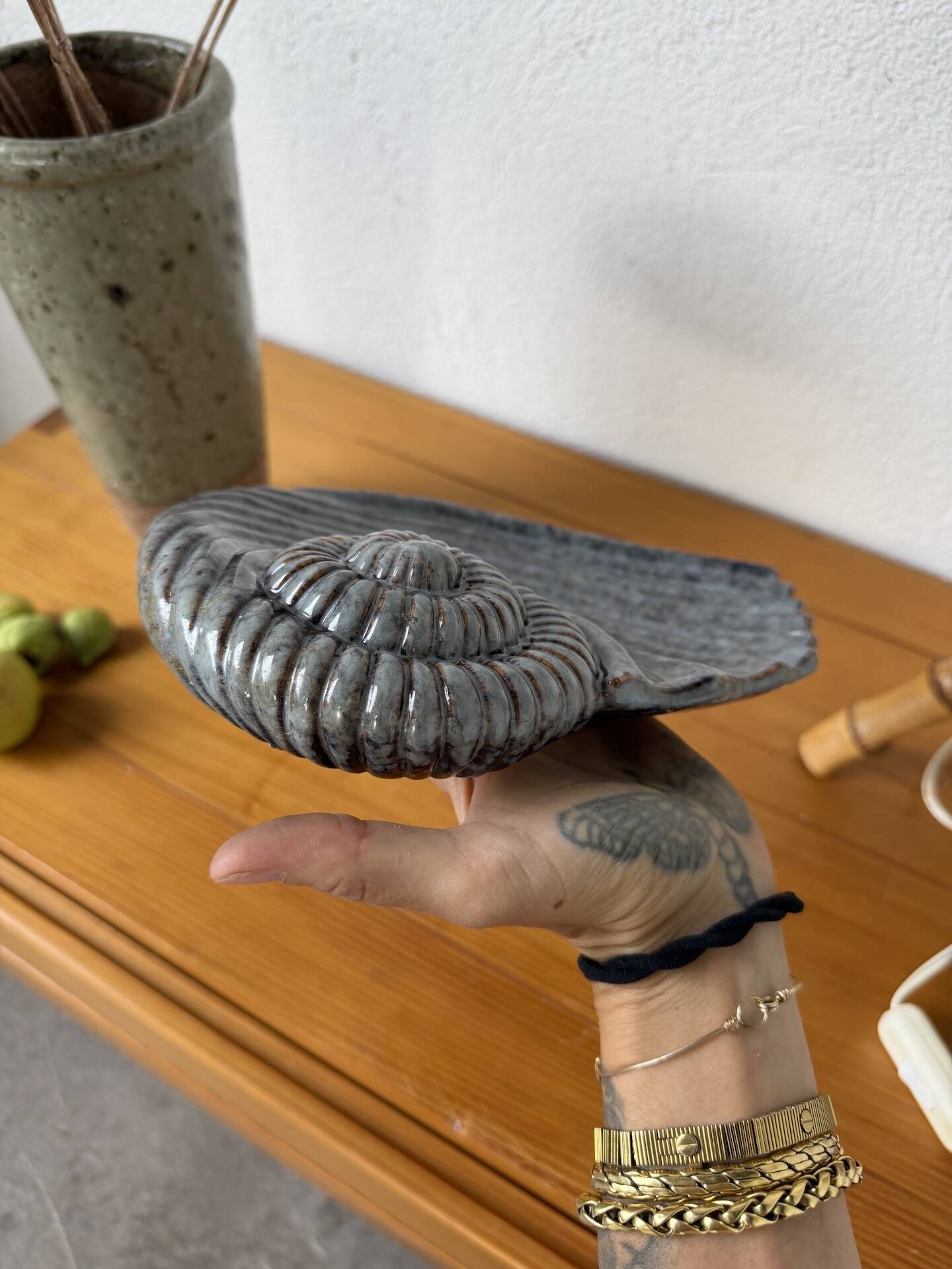 Shell-shaped ceramic catchall.