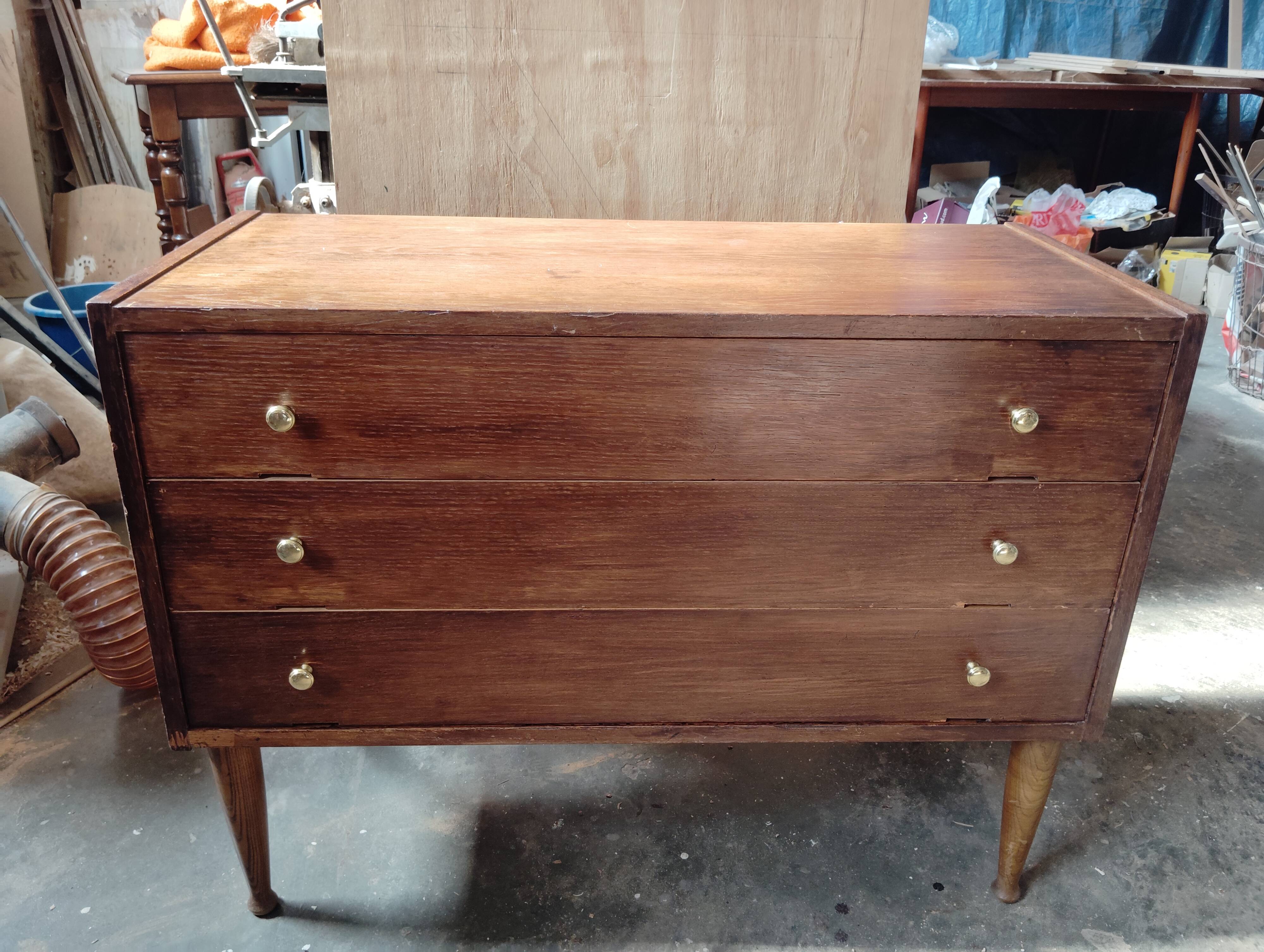 Vintage commode with tapered legs.
