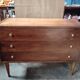 Vintage commode with tapered legs.