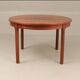 Round dining table in rosewood.