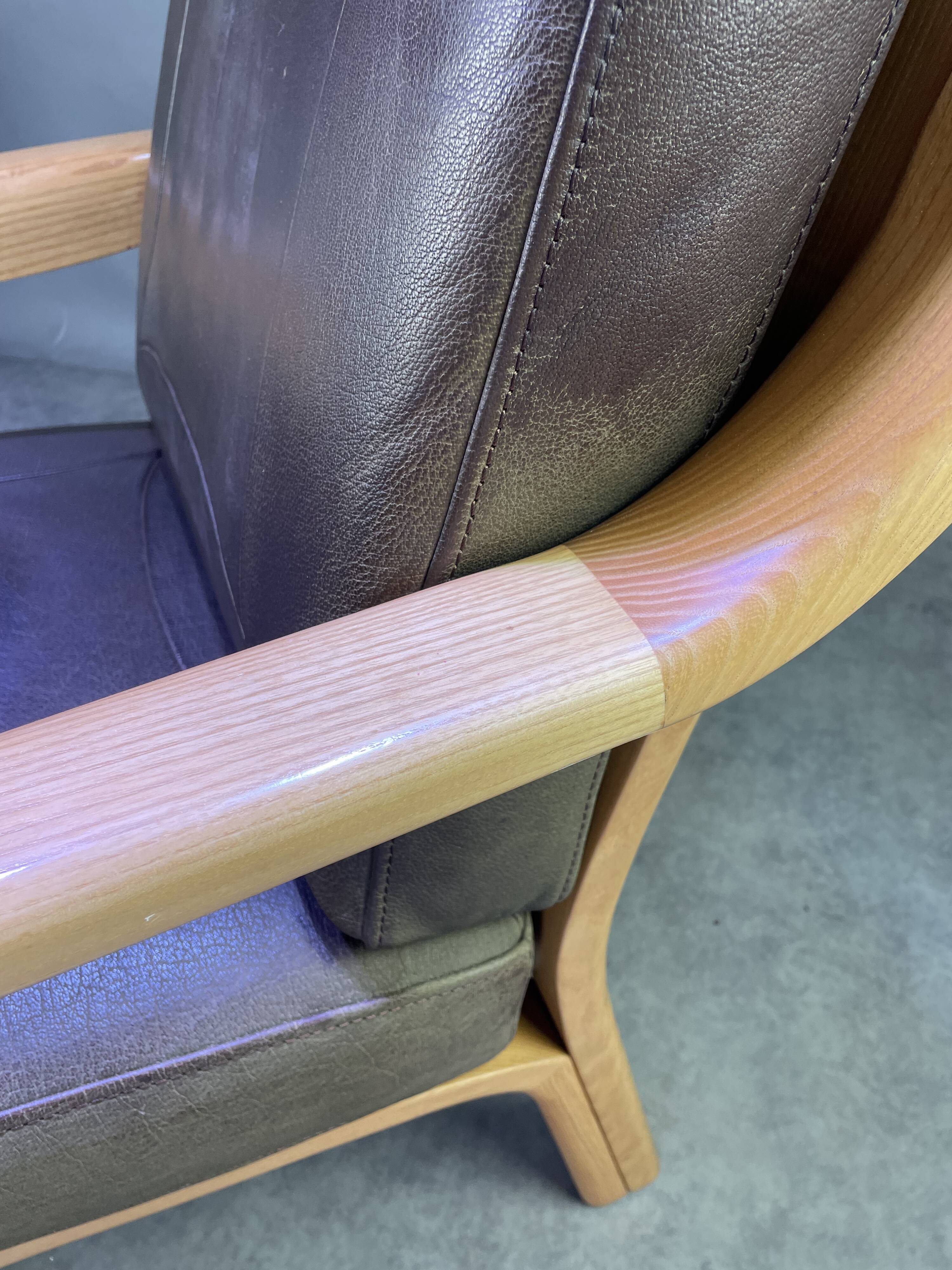 Chocolate leather armchair, wooden structure