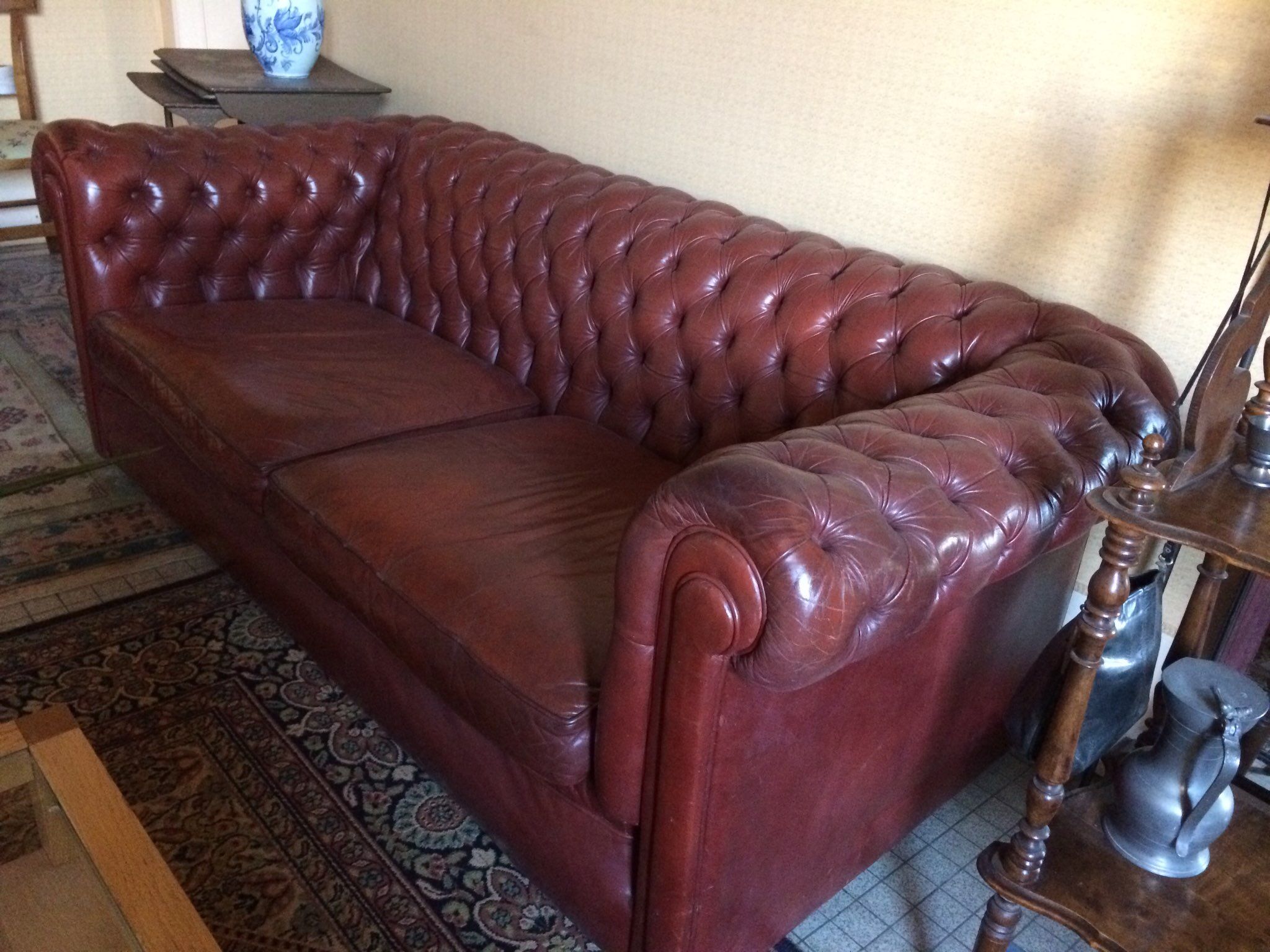 Old red leather Chesterfield sofa