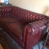 Old red leather Chesterfield sofa