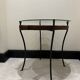 decorative wrought iron round table, glass and wood top.
