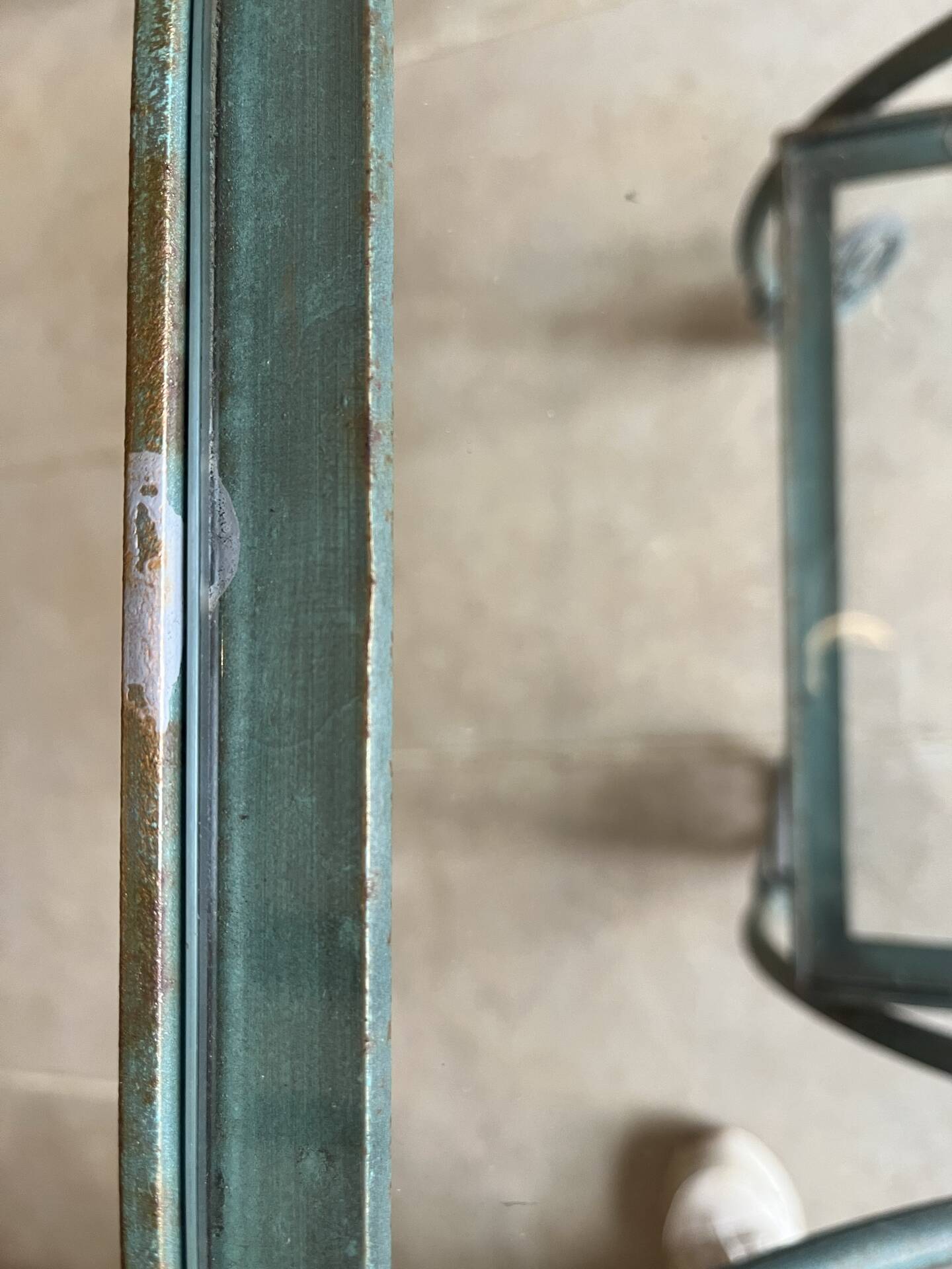 Patinated green-grey wrought iron dessert table