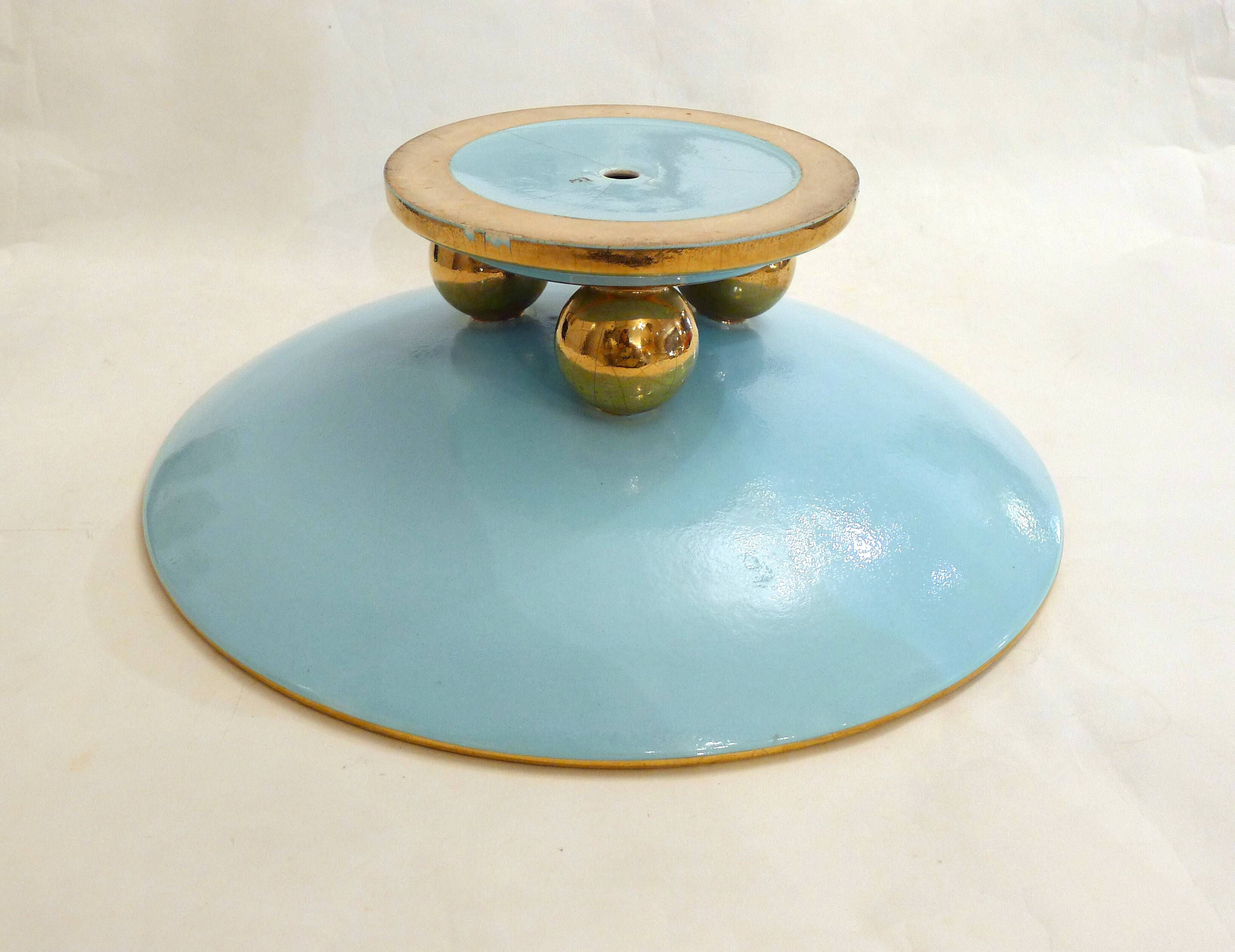 Art Deco modernist coupe, with a base of 3 spheres, in turquoise ceramic and gilding.