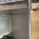 Vintage coffee table on chrome wheel and smoked glass