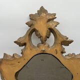 Wooden mirror with gilded stucco