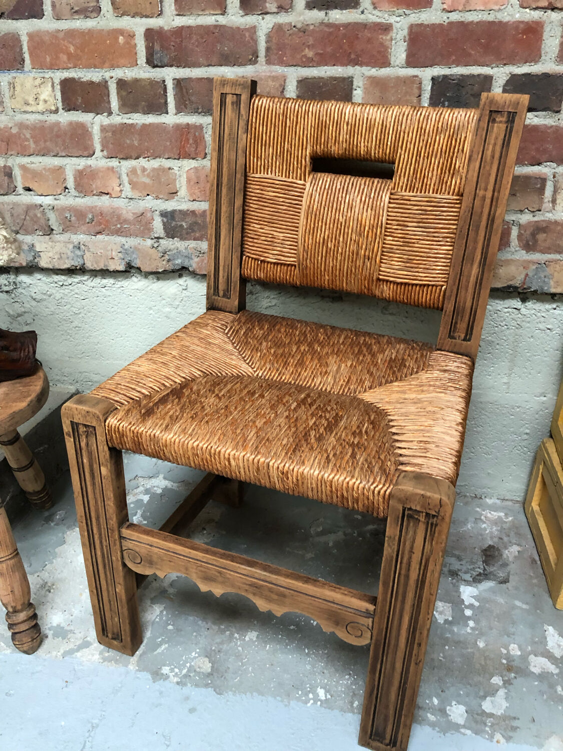 Old straw brutalist chair