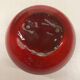 Red ceramic ball vase signed A