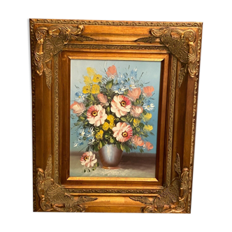 Still life painting with bouquet of flowers in a gilded wooden frame