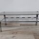 Vintage smoked glass coffee table with chrome legs.