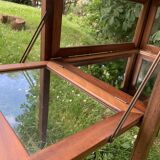 Glass-enclosed old tea table with wooden tray, bronze and brass