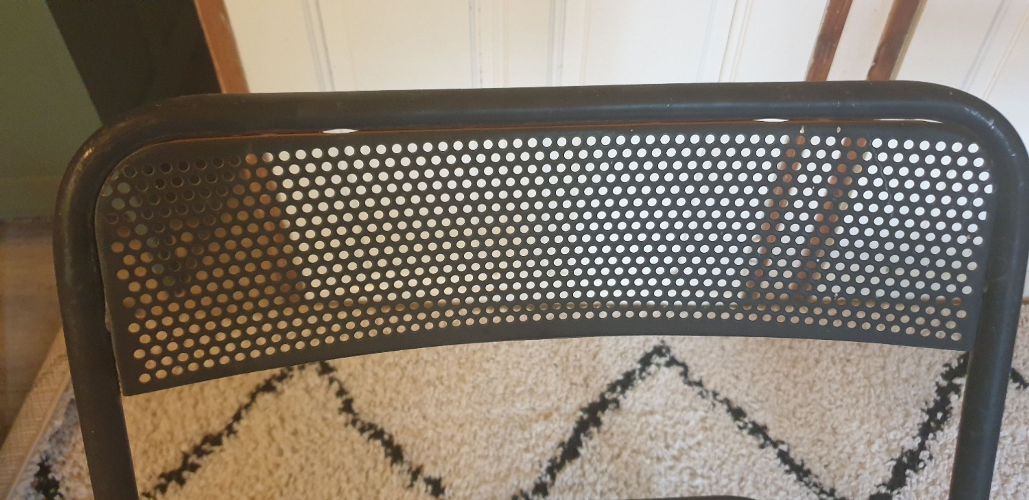 Pair of folding chairs in perforated metal