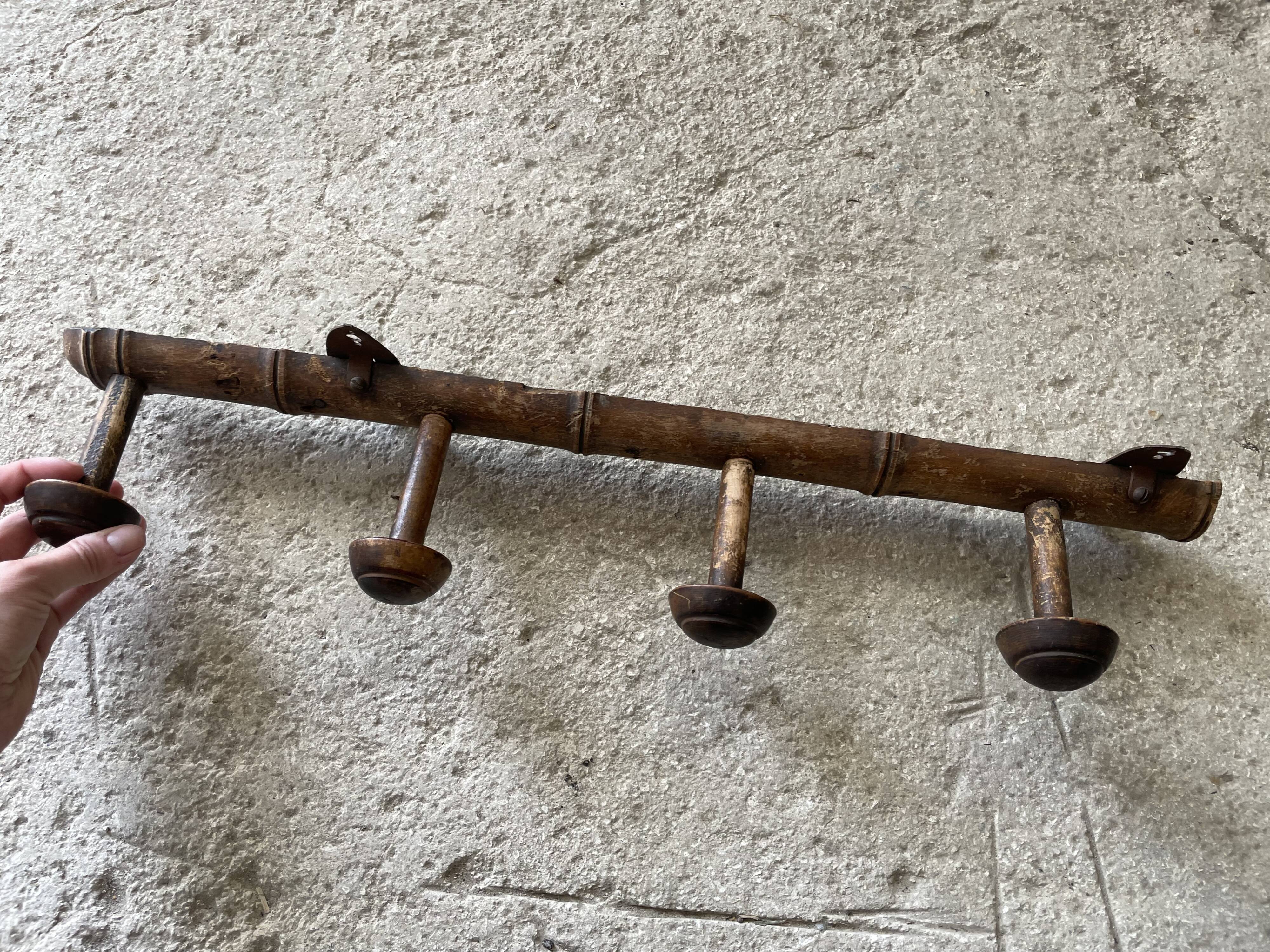 Old wooden wall coat rack