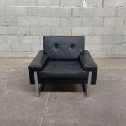 Pair of black leather armchairs