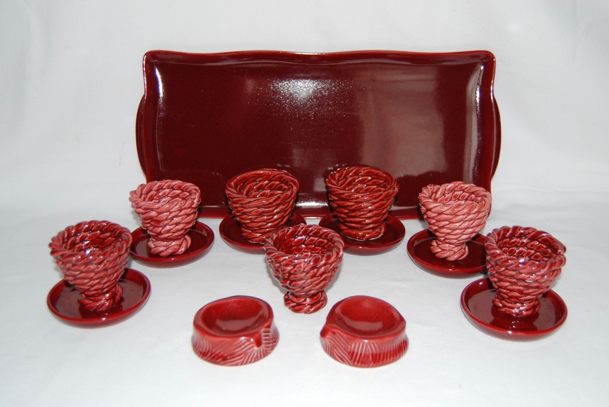 Set of 7 eggcups by Louis Bacculini, Vallauris, with 2 cups of salt, 6 saucers
