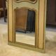 Trumeau mirror with cracked patina and oil on panel depicting a romantic scene from the 19th century.