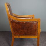 Armchair in sheepskin with beautiful light wood