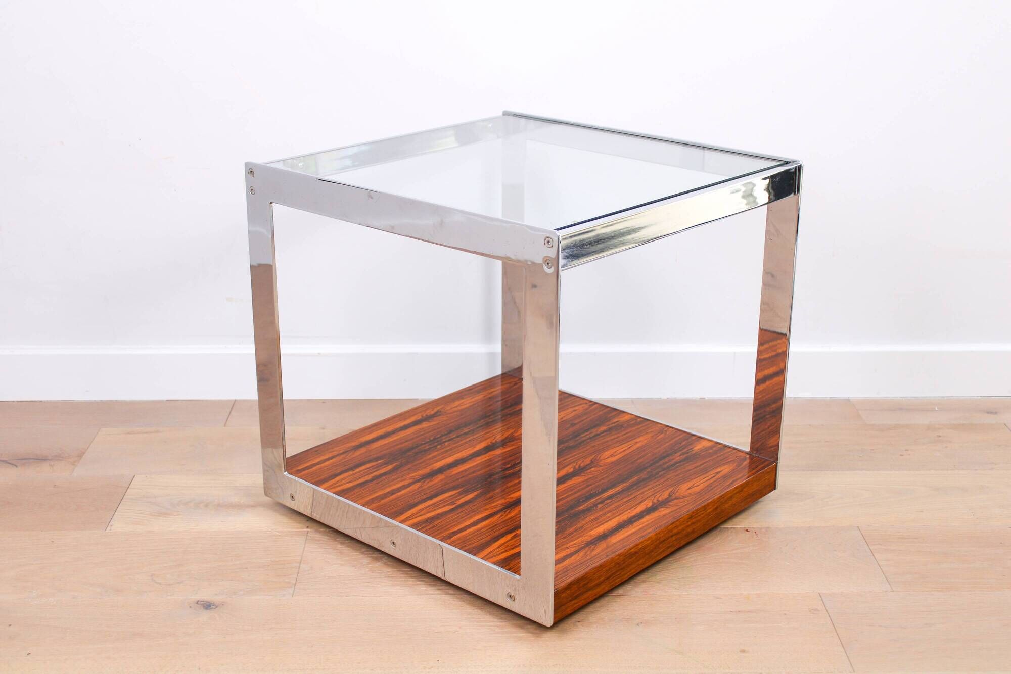 A vintage mid-century glass and rosewood side table by Merrow Associates