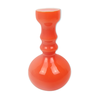 Orange glass vase and white interior