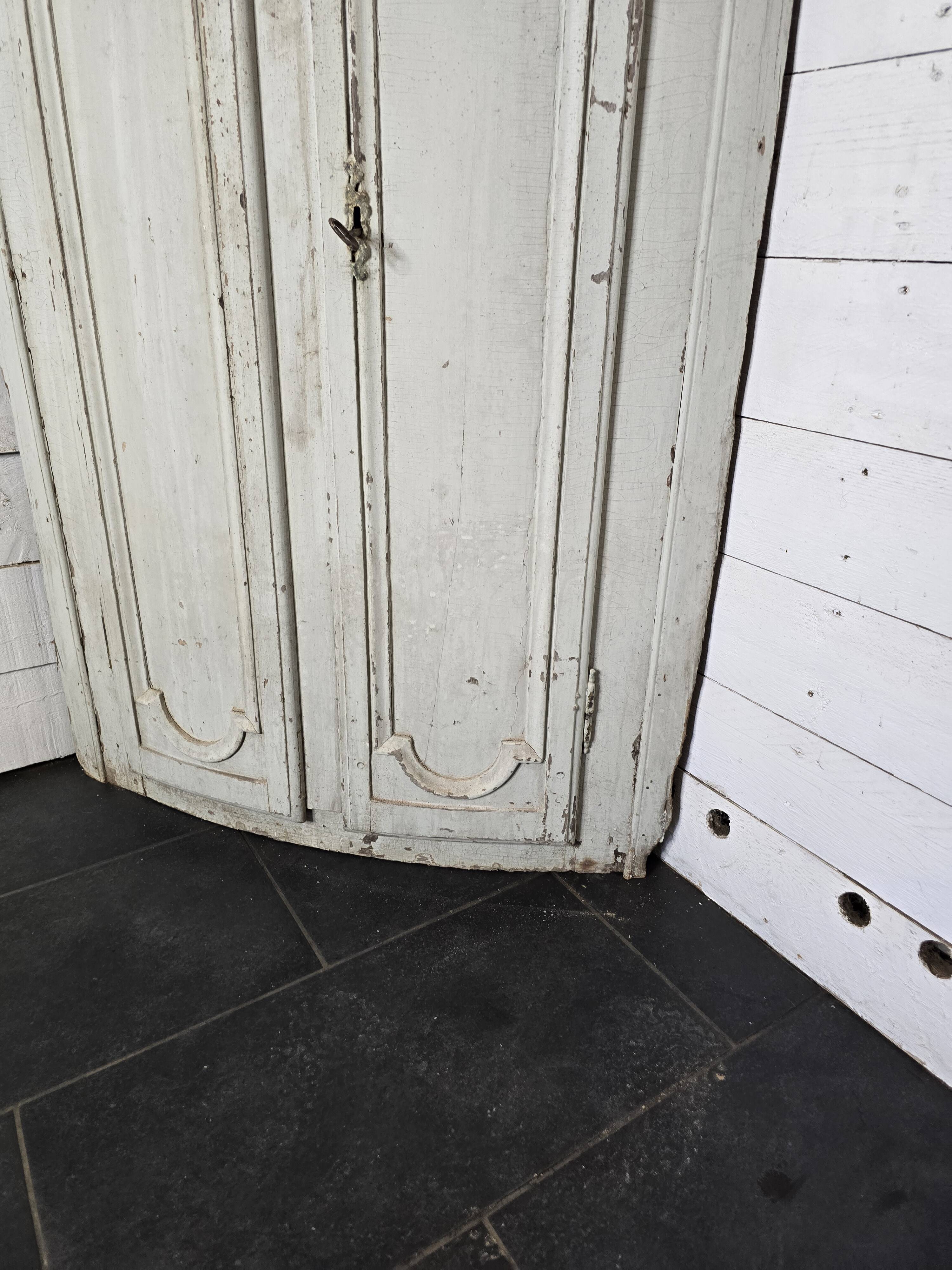 19th century curved corner cupboard in patinated oak