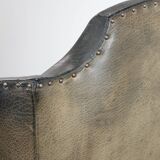 Antique black English cow leather wingback armchair from the 19th century