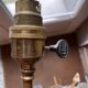 Rare articulated tripod base table lamp in gold-plated brass