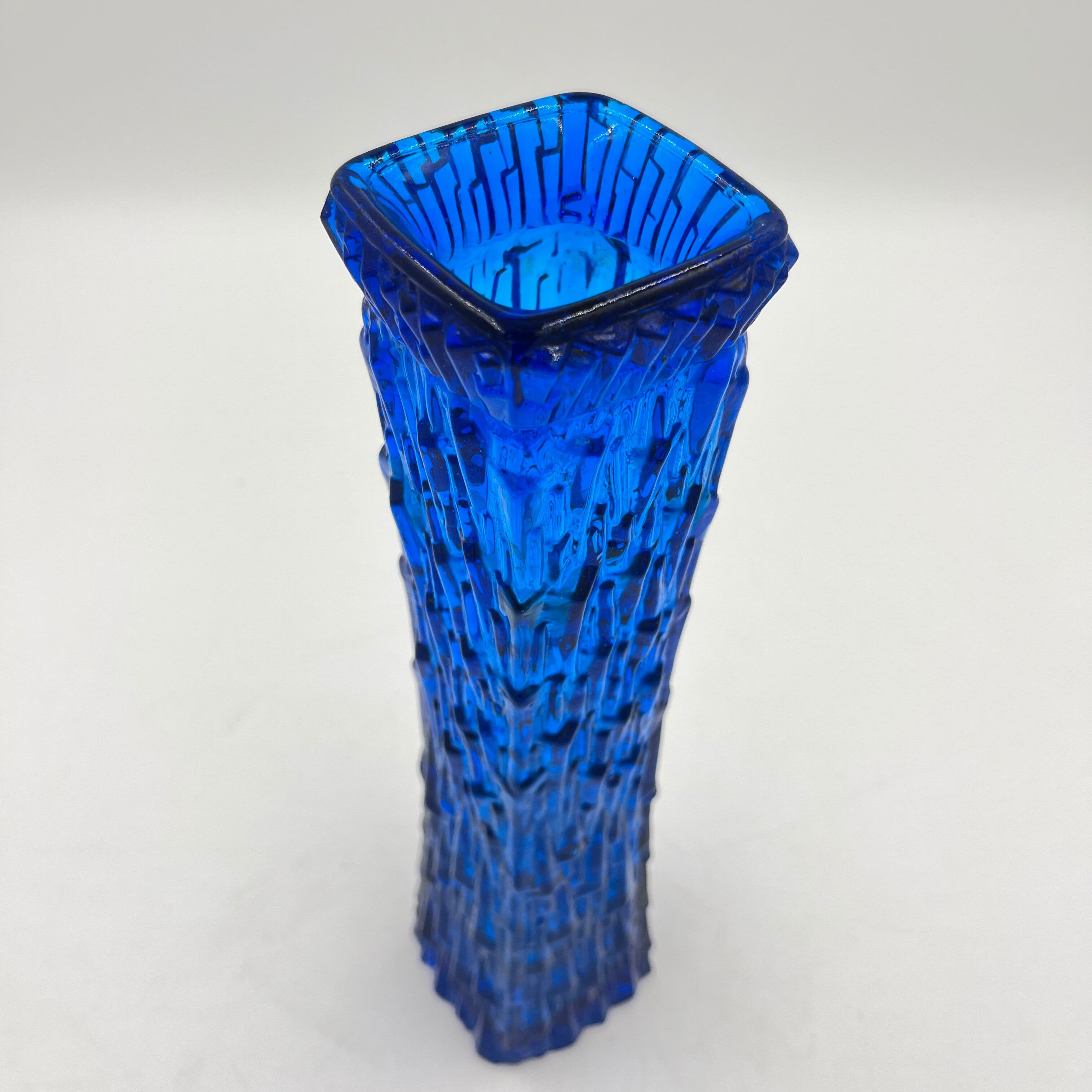 Blue glass vase with relief