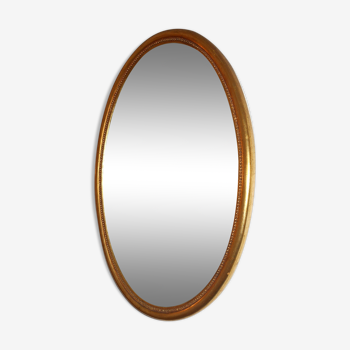 Oval gold mirror