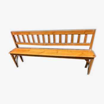 Old wooden long station bench from Belgium