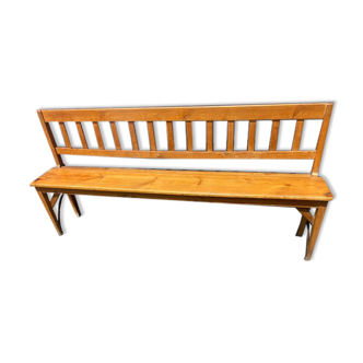 Old wooden long station bench from Belgium