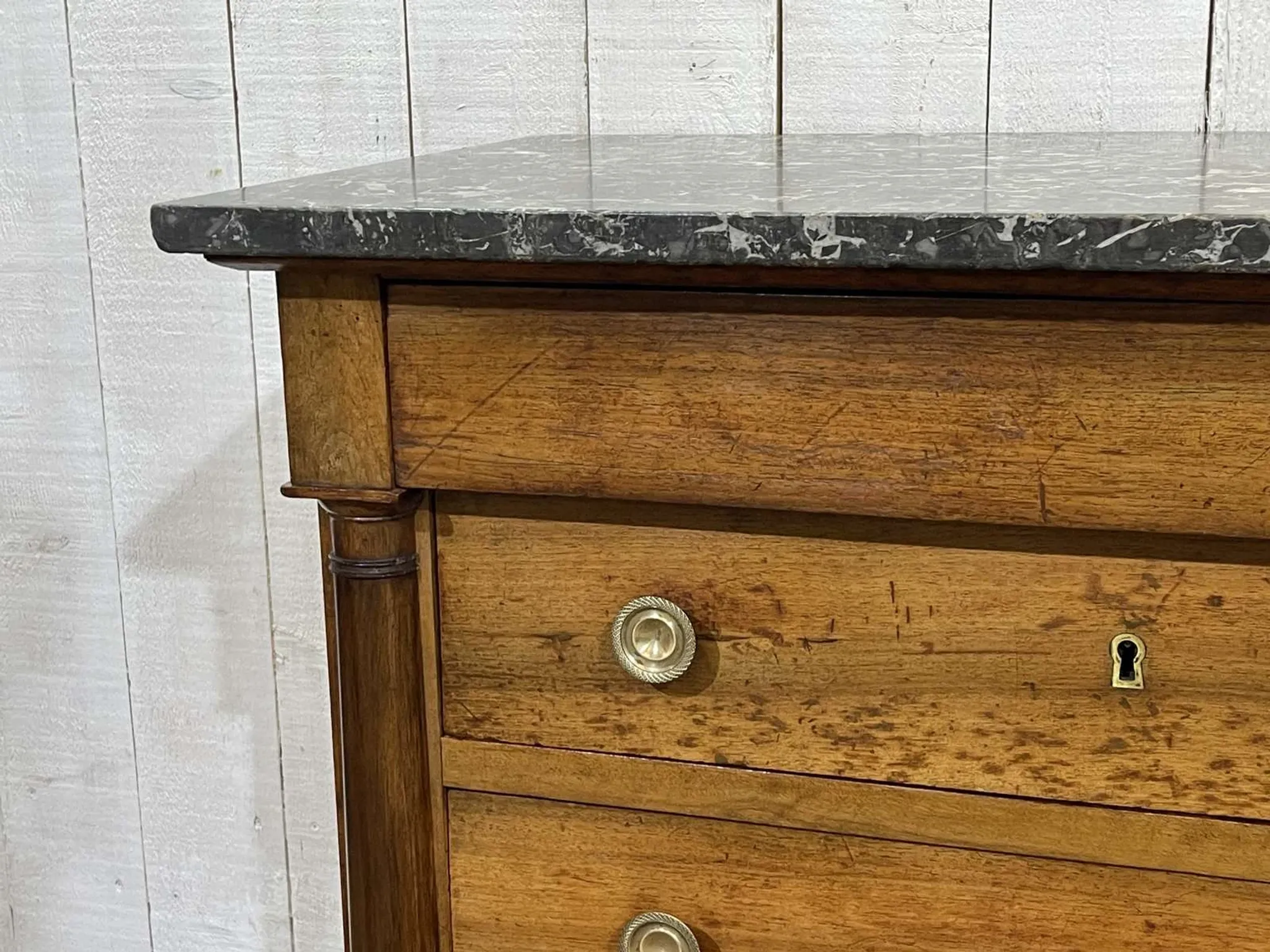 19th-century Empire commode in walnut with a grey St Anne marble top.