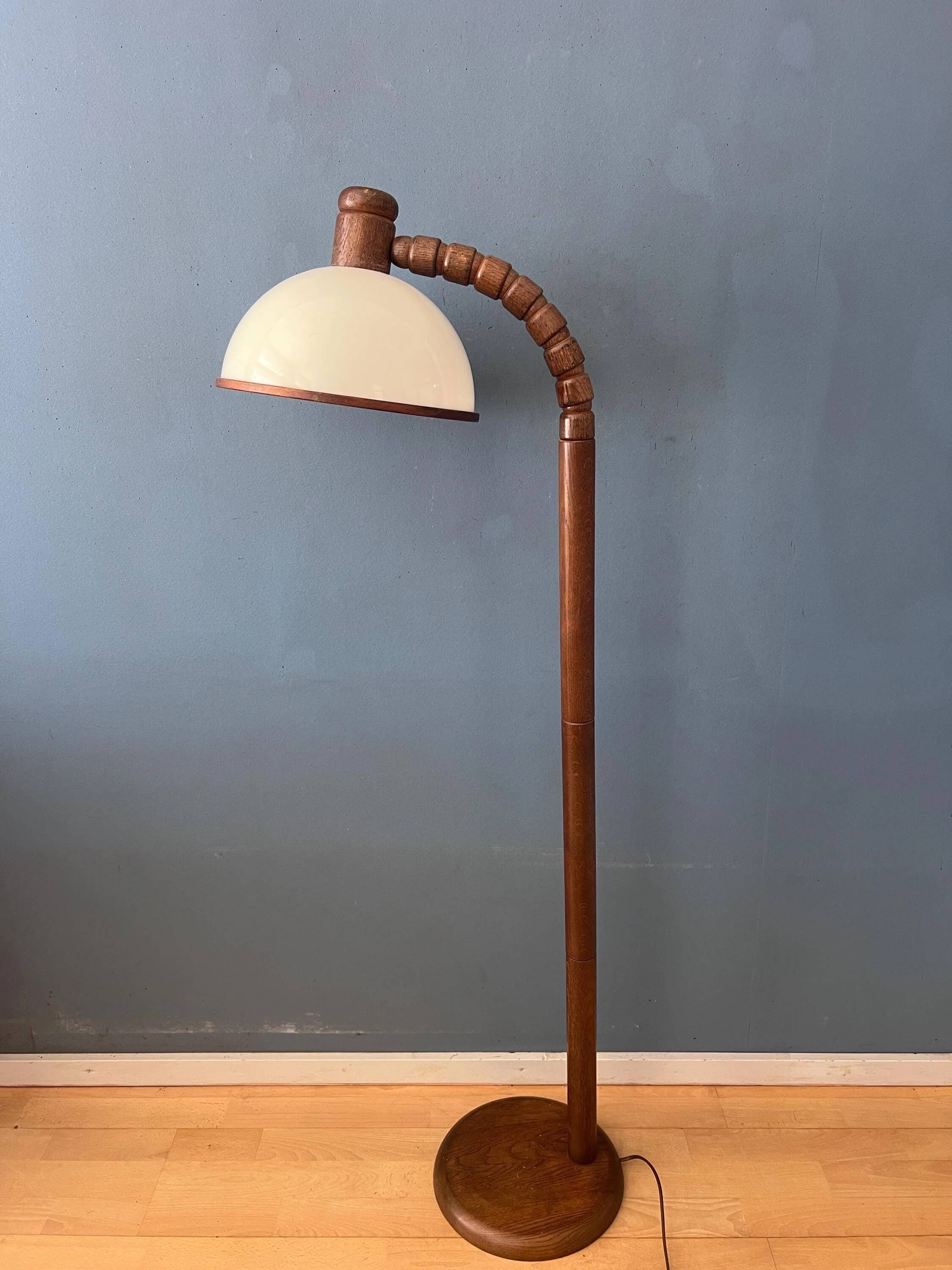 Mid-century floor lamp in brown wood by Steinhauer with an acrylic glass shade.