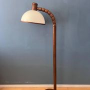 Mid-century floor lamp in brown wood by Steinhauer with an acrylic glass shade.