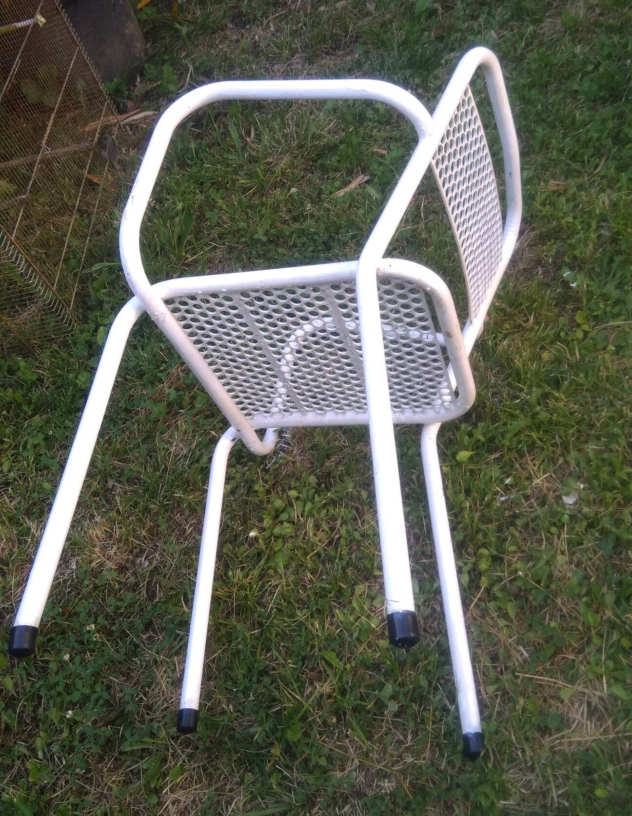 Set of 4 stackable perforated garden armchairs