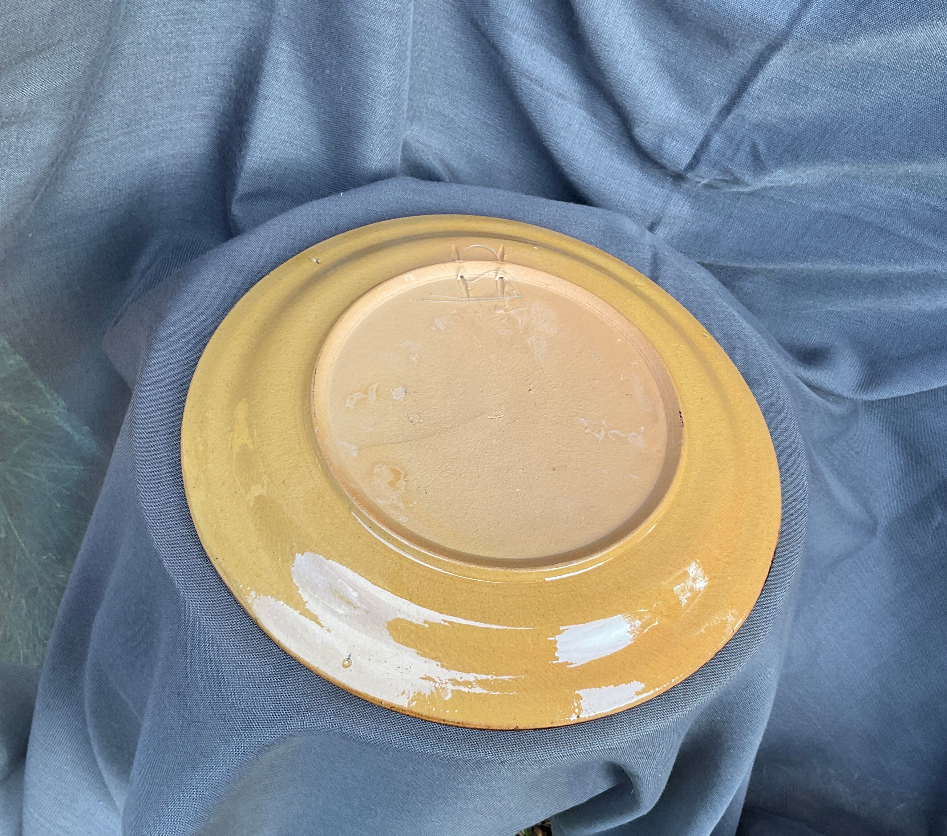 Terracotta plate with floral decoration