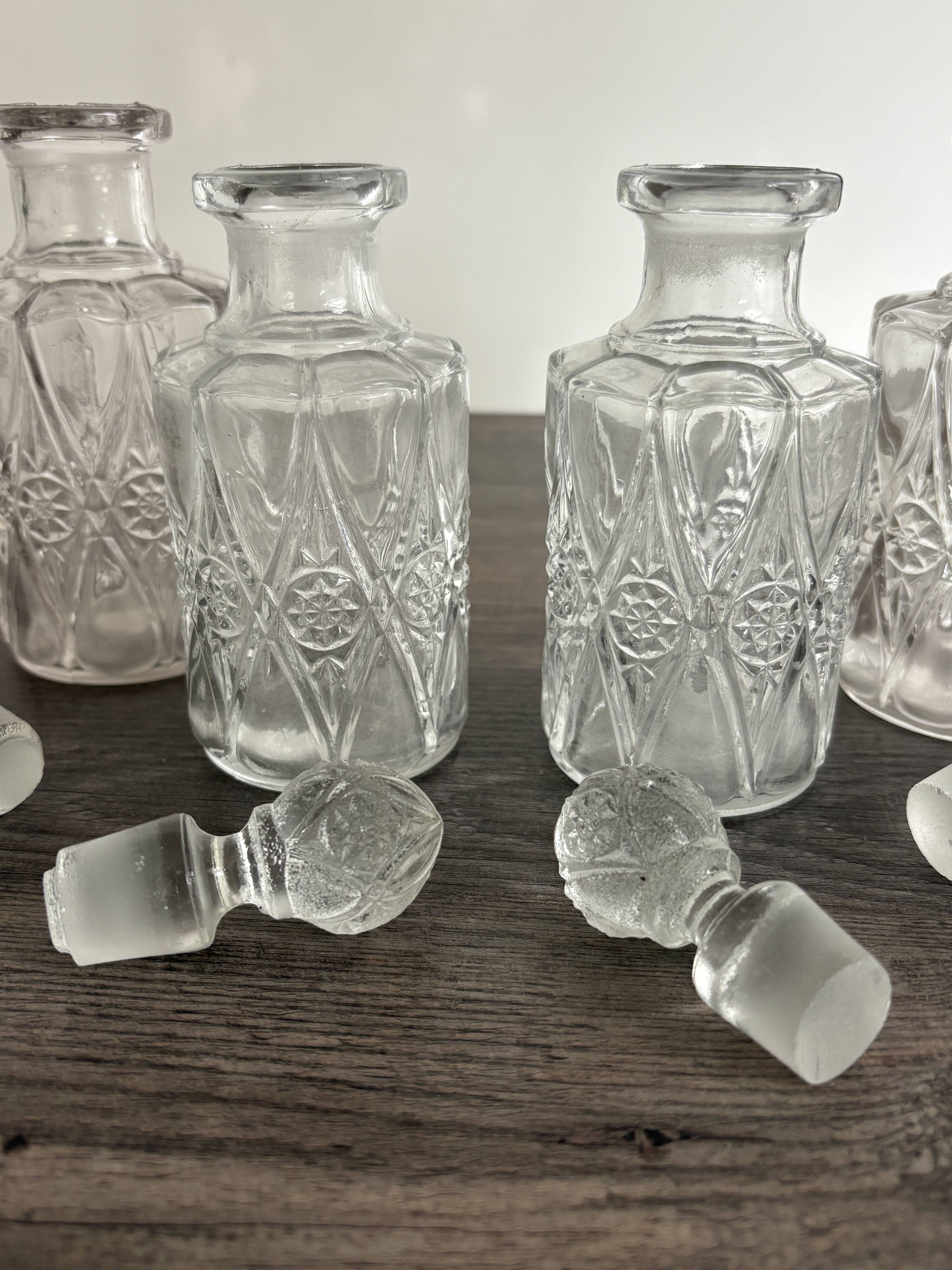 Set of 4 molded crystal bottles – Val Saint Lambert