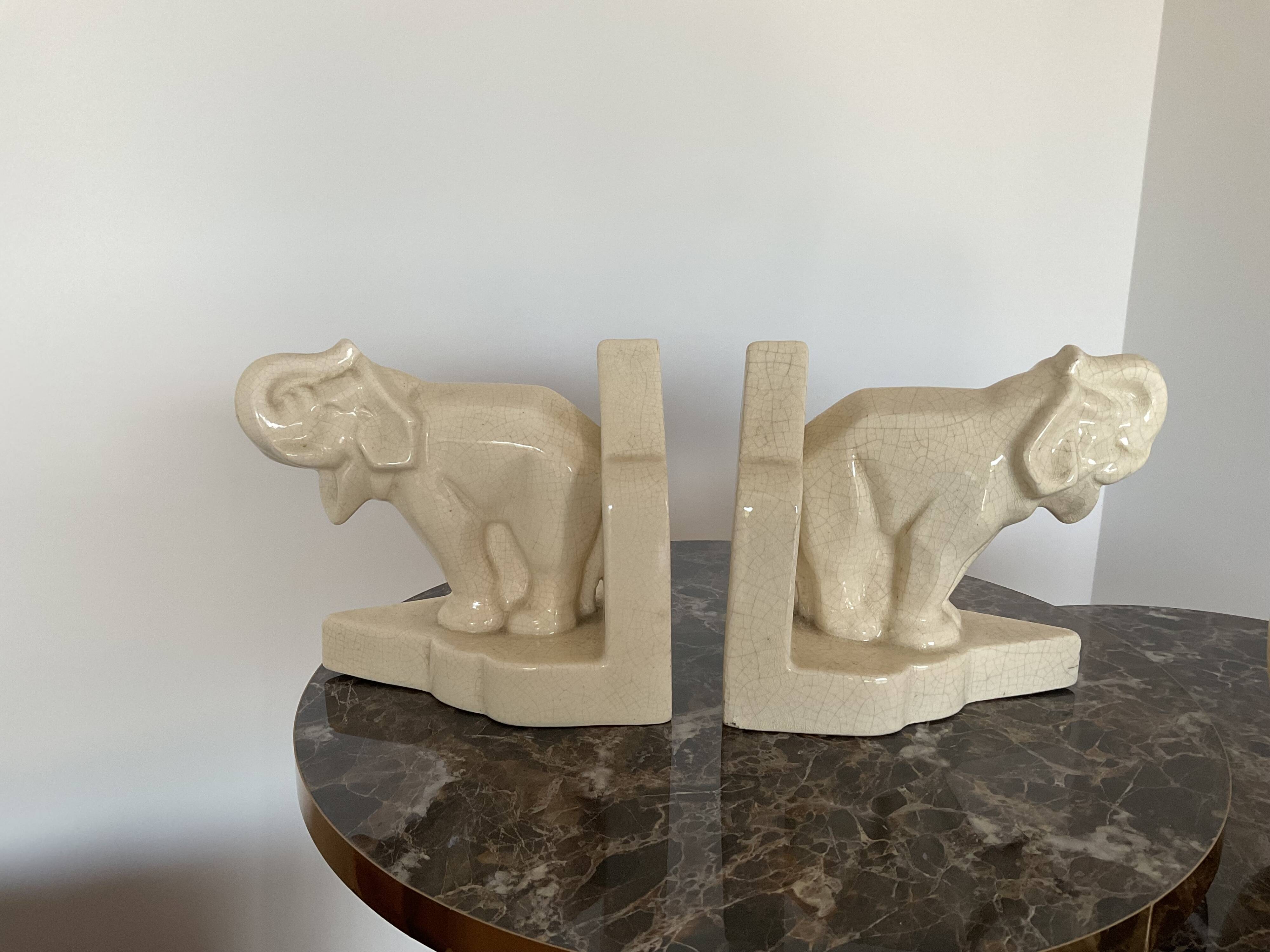 Pair of cracked earthenware bookends. ART DECO
