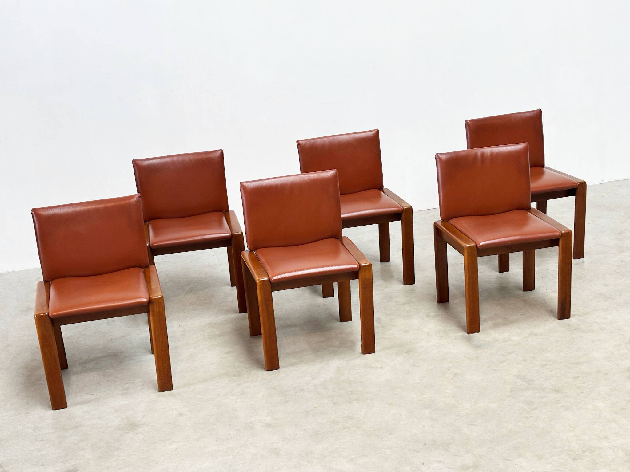 Set of six leather Italian dining chairs