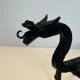 Paire de chenets aux dragons en fer forgé