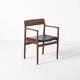 Fauteuil en palissandre et cuir noir, par J. Norgaard, Danemark, années 1960.